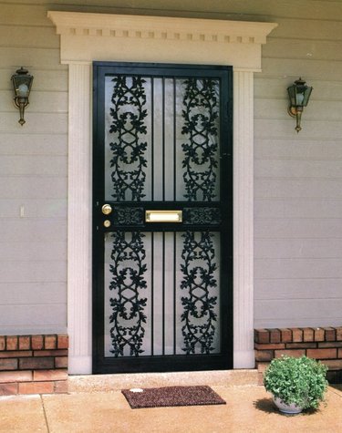 Storm doors with mail slot